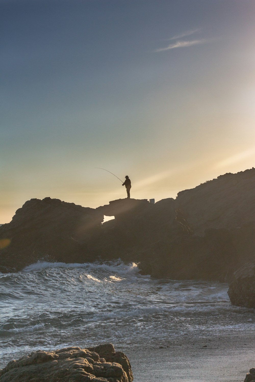 man standing on the cliff