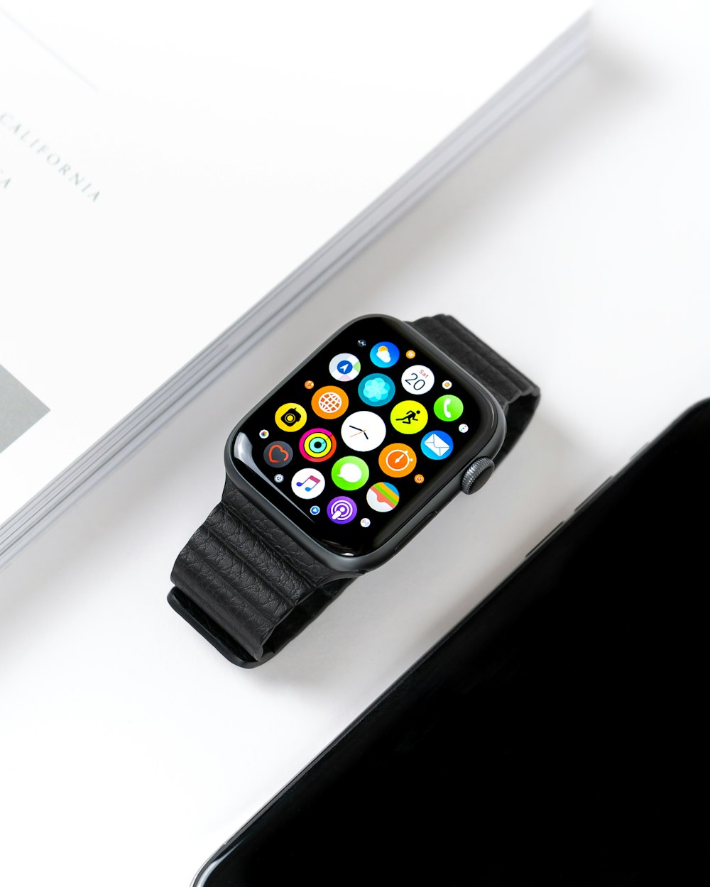A refurbishe Apple watch in a box with the screen illuminated