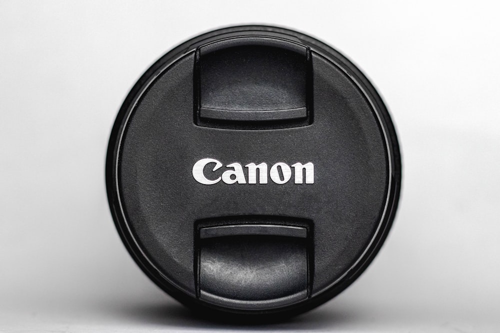 black Canon lens cover