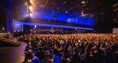 people inside stadium audience teams background