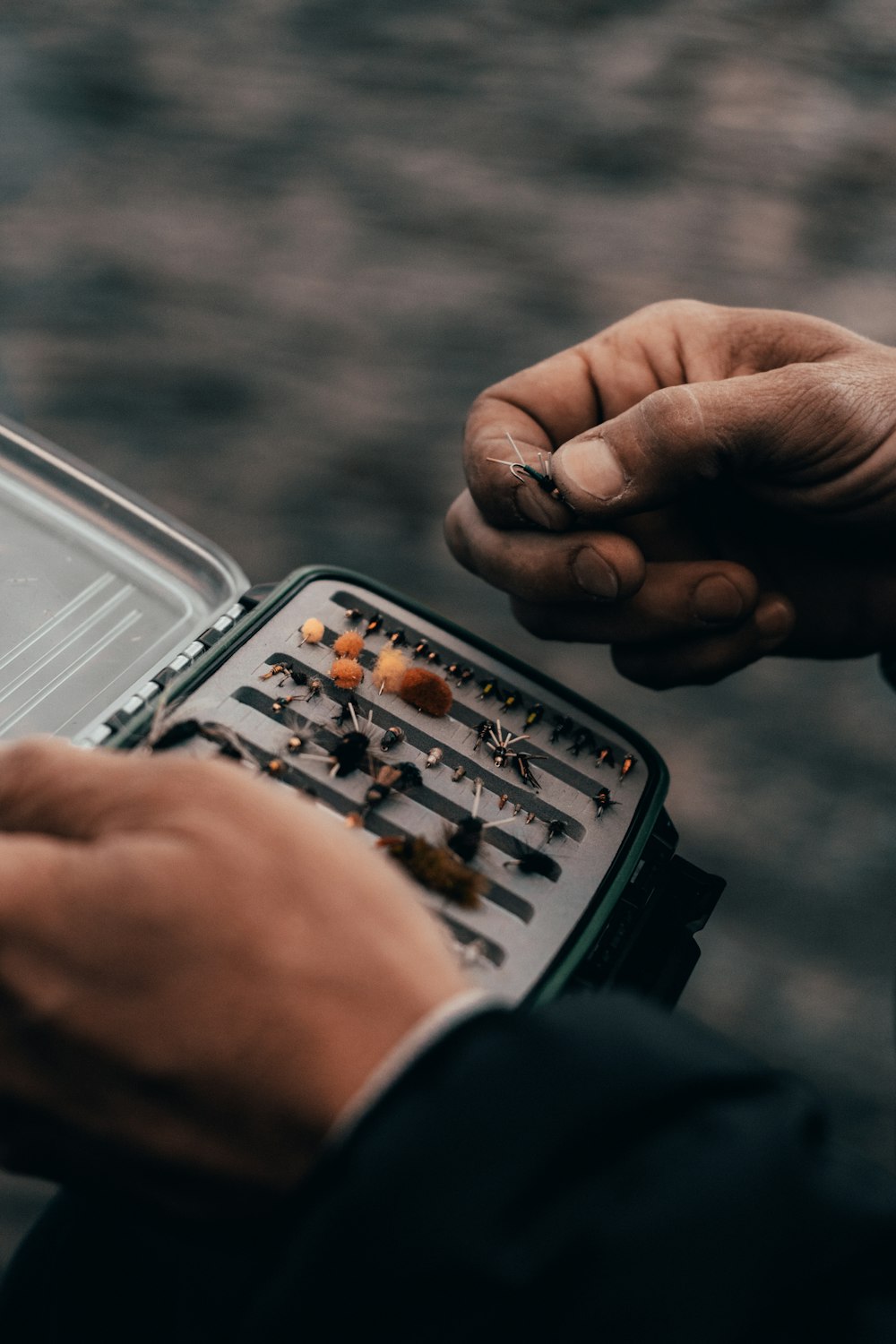 person holding tool bit case