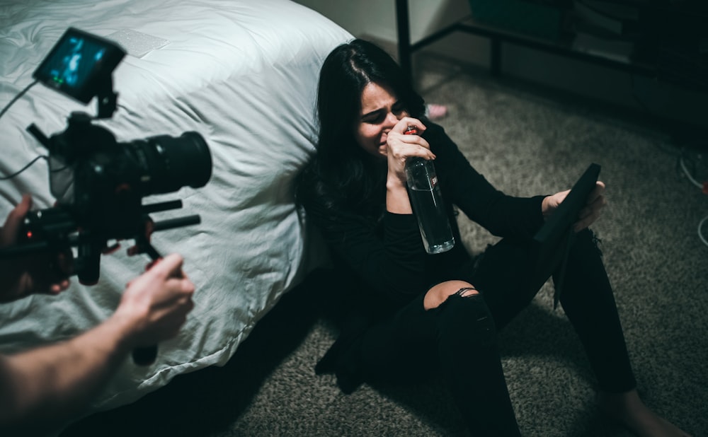 woman sitting on floor