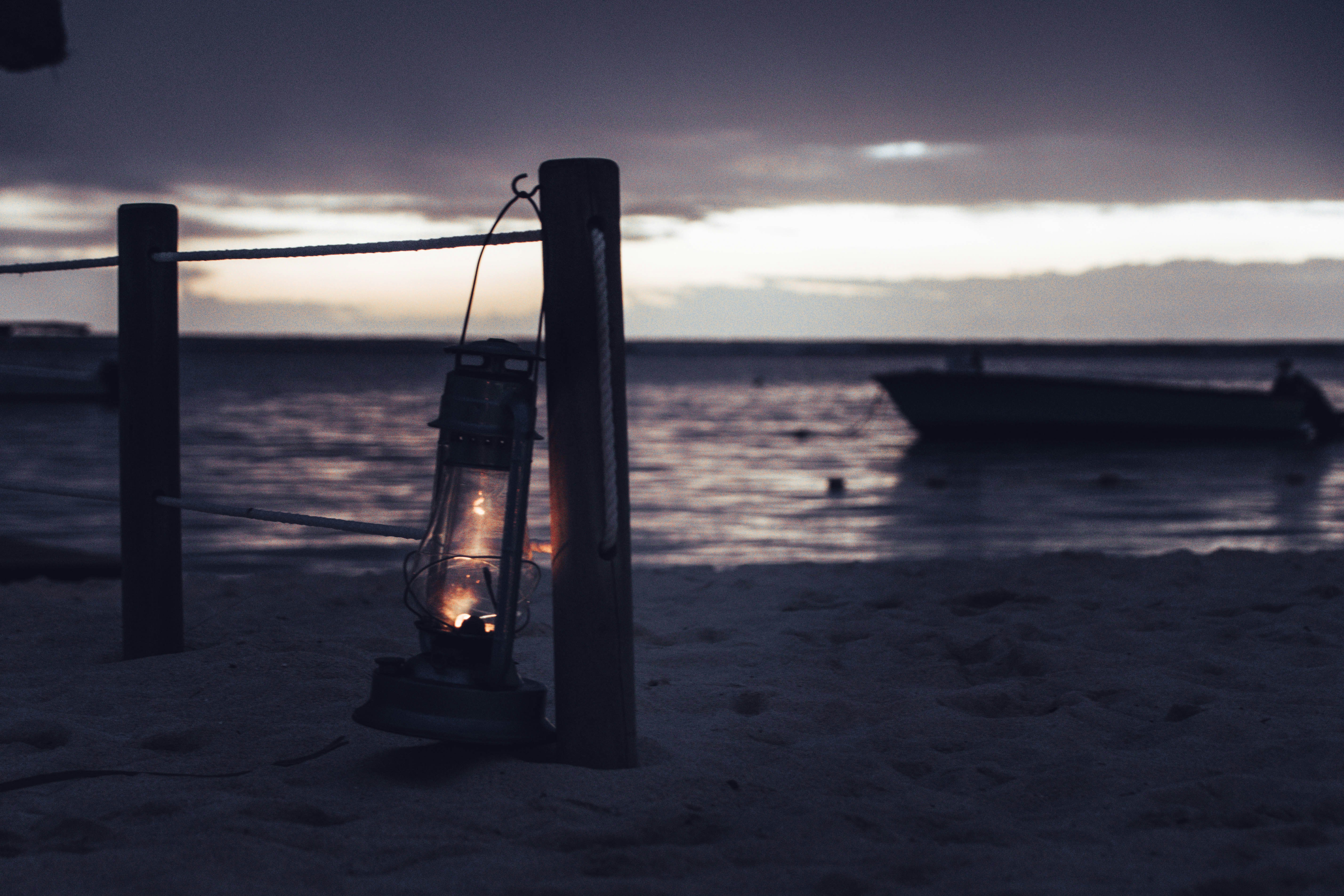 gray kerosene lantern, Lantern by the ocean