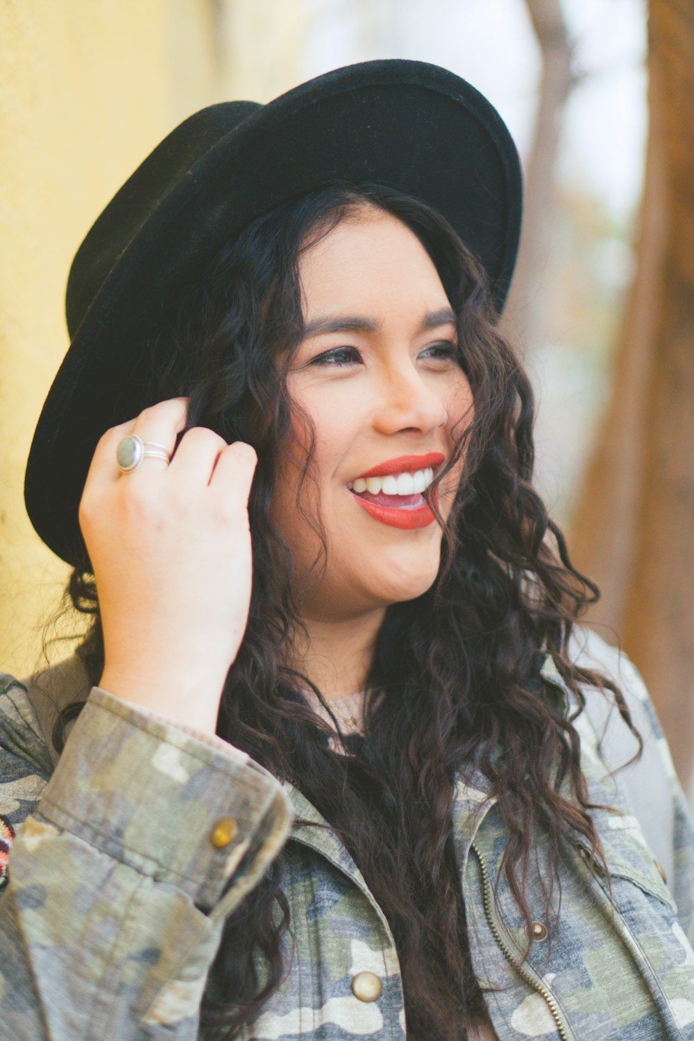 woman wearing black cap