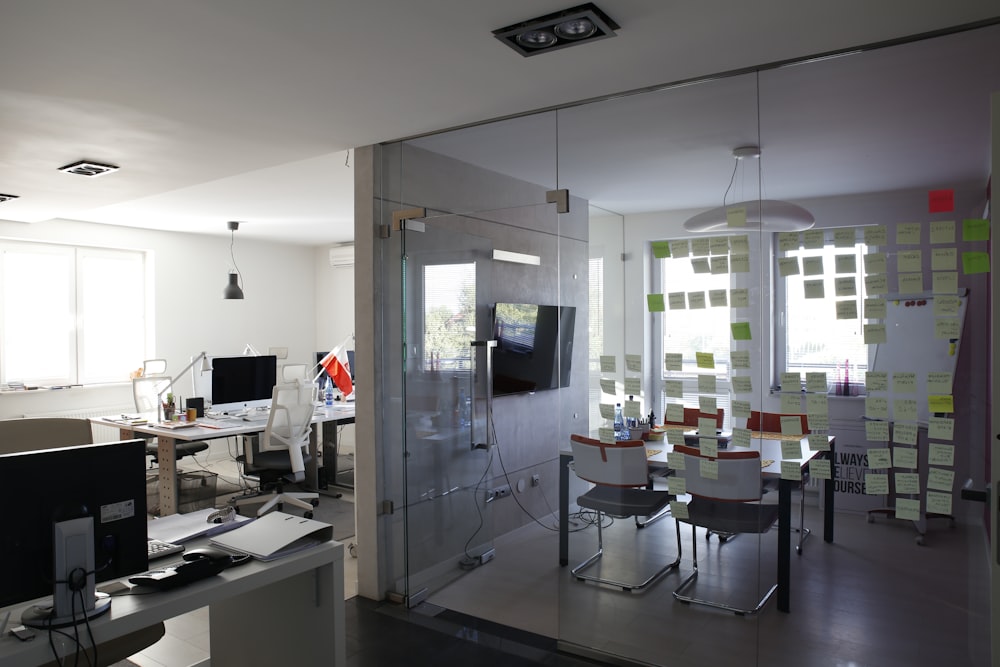 black and gray flat screen computer monitor and dining room