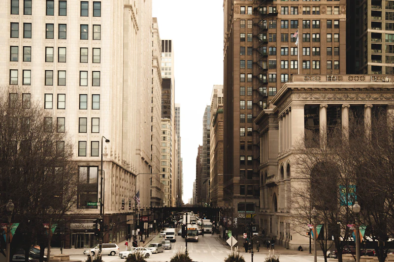 Street-level view of high-rise buildings lining a Loop street in downtown Chicago
