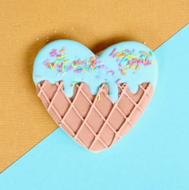 pink and blue icing coated cookie