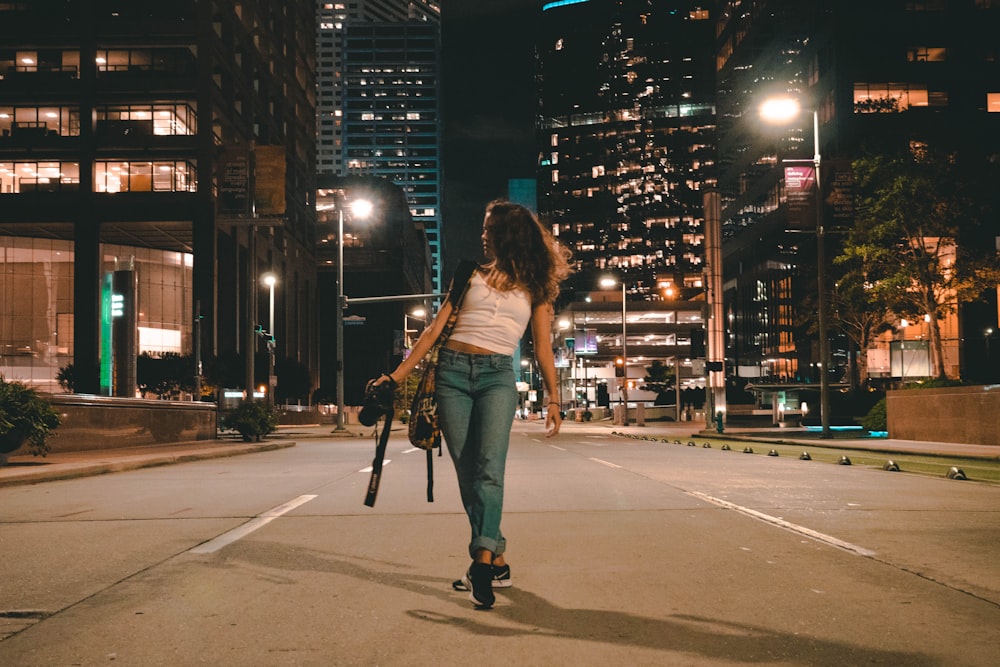 woman holding DSLR camera