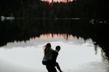 man carrying woman in his back