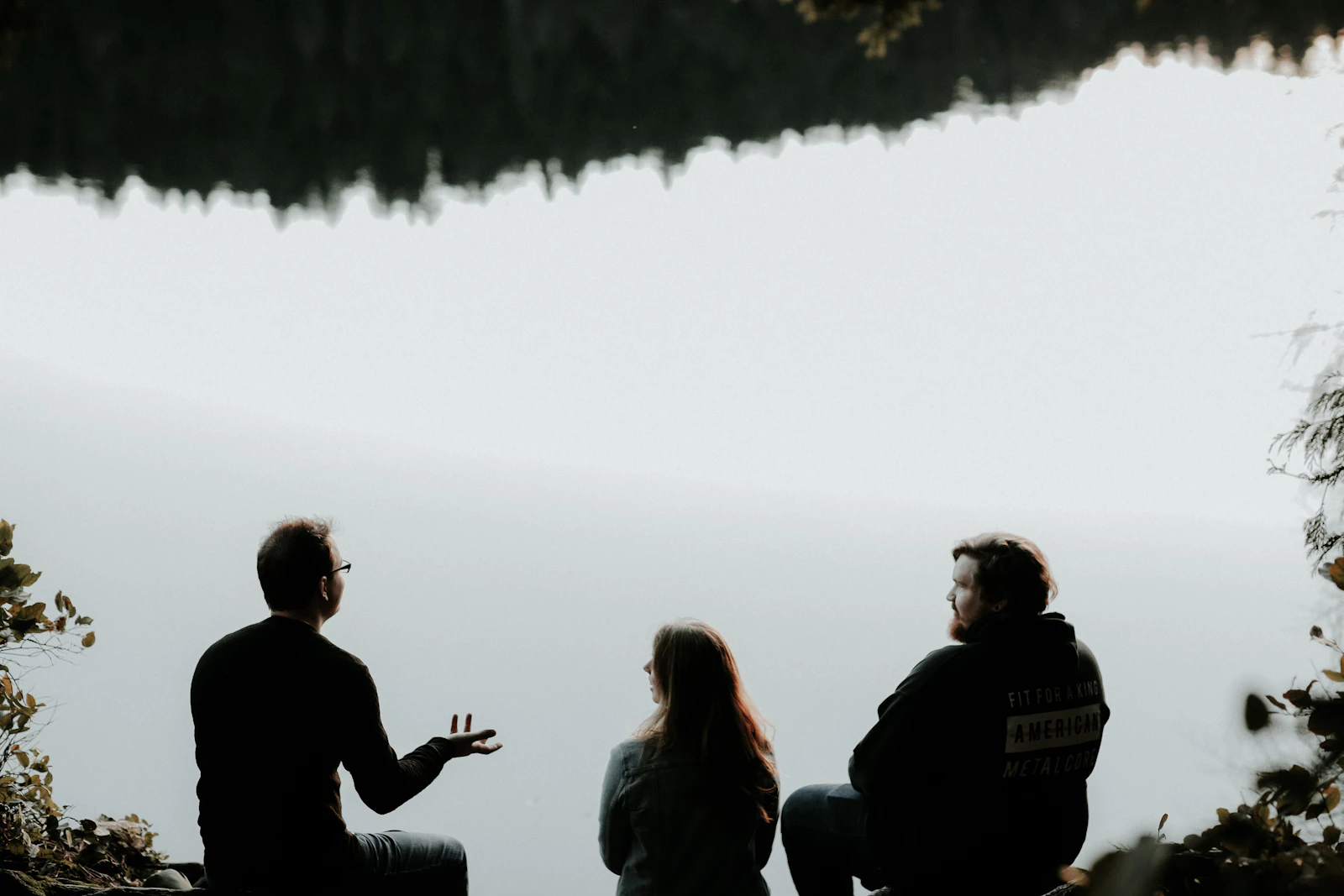 Friends talking on a clifftop