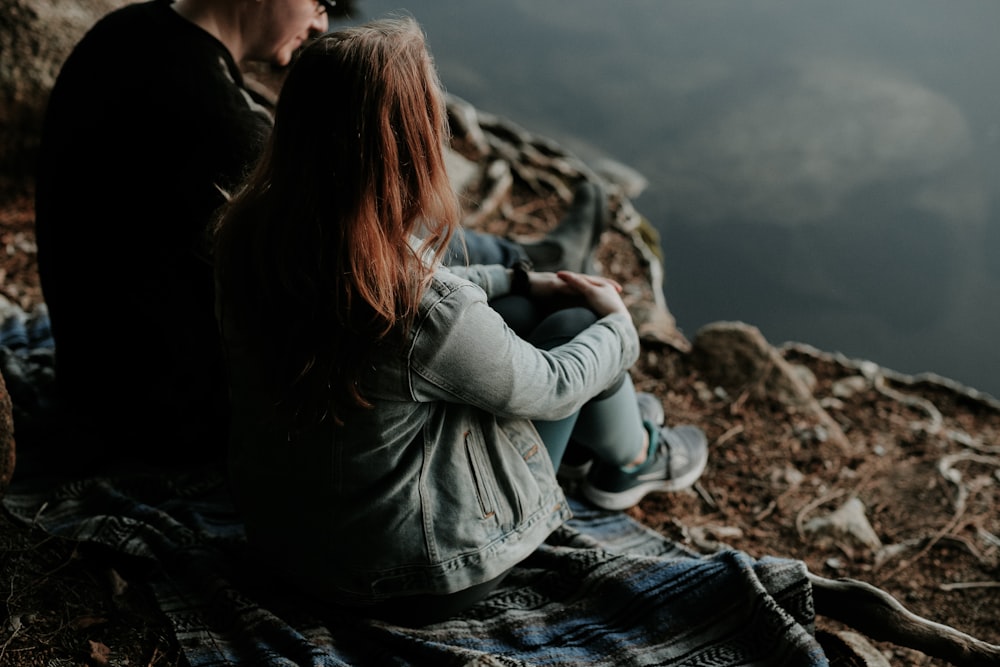 man and woman sitting outdoor