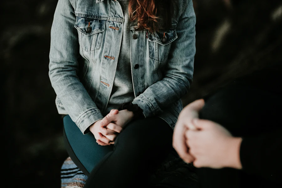 A supportive therapy session: two people seated in conversation in a calm space