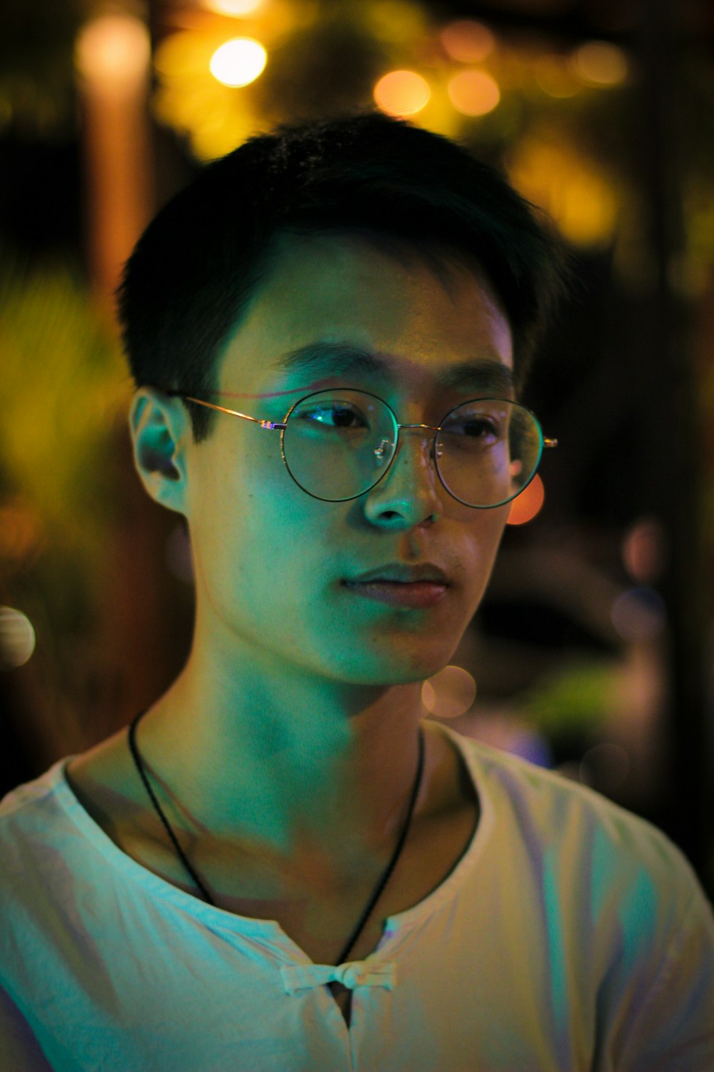 man wearing gray framed eyeglasses in selective focus photography