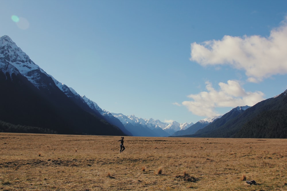 person near mountains during day time