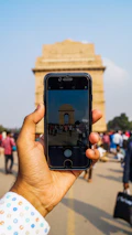 A traveler capturing a photo of a famous international landmark.