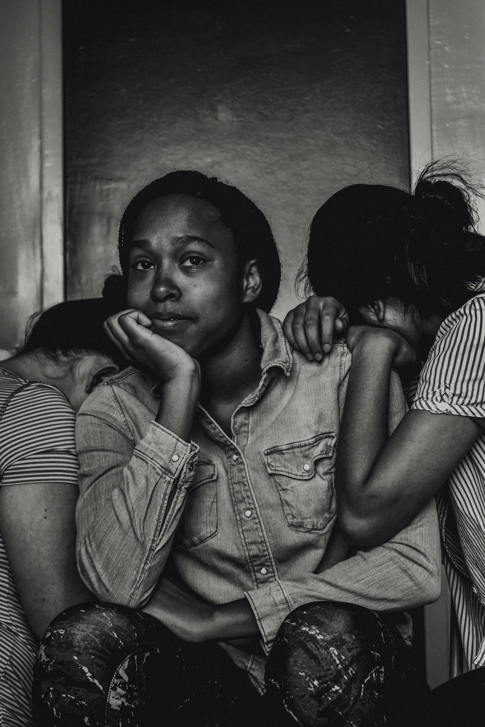 men sitting between two women