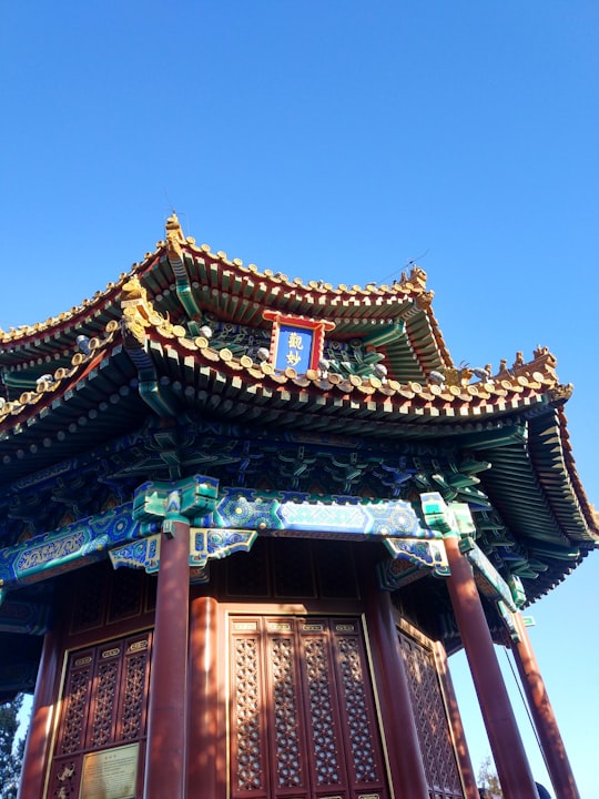 brown and black wooden castle in Jingshan Park China