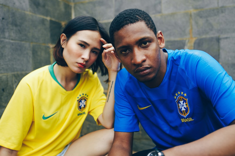 photo of man and woman wearing shirts