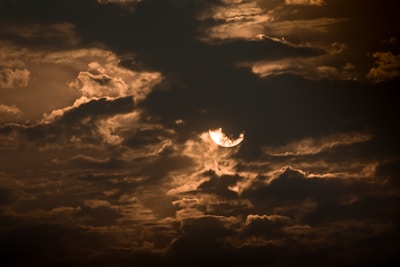A dramatic twilight exterior photo with warm golden lighting.