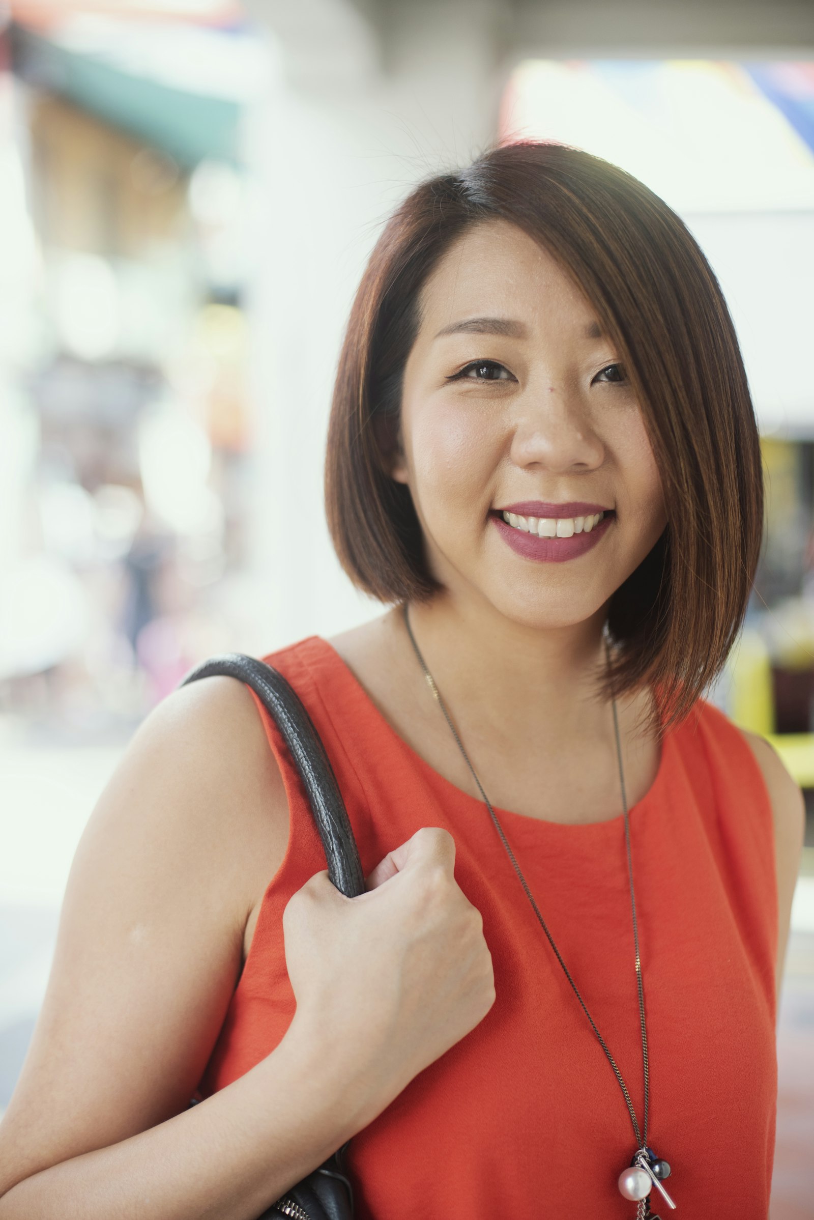 Nikon D750 + Nikon AF Nikkor 50mm F1.4D sample photo. Woman holding her bag photography