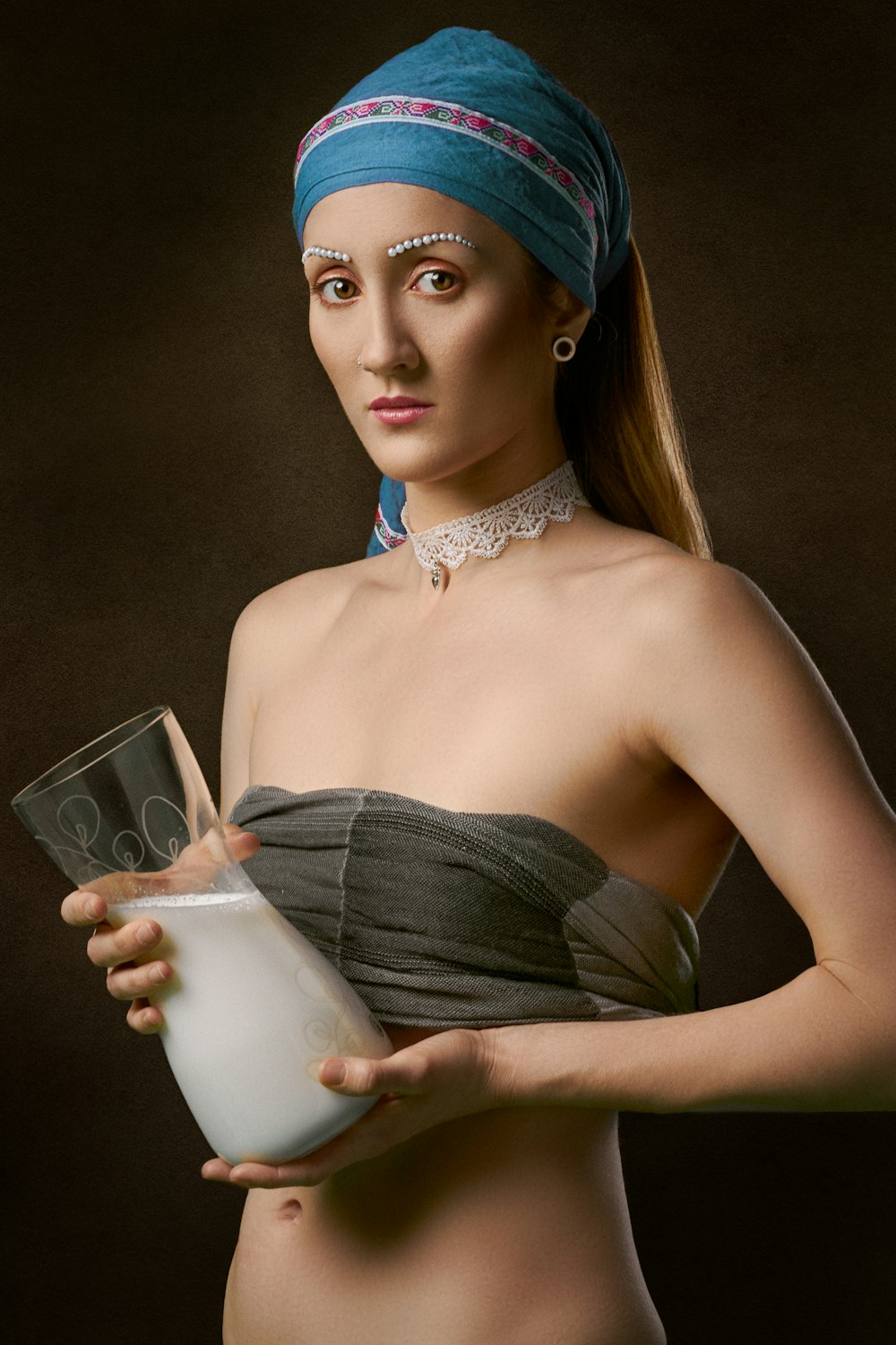 woman holding pitcher of glass