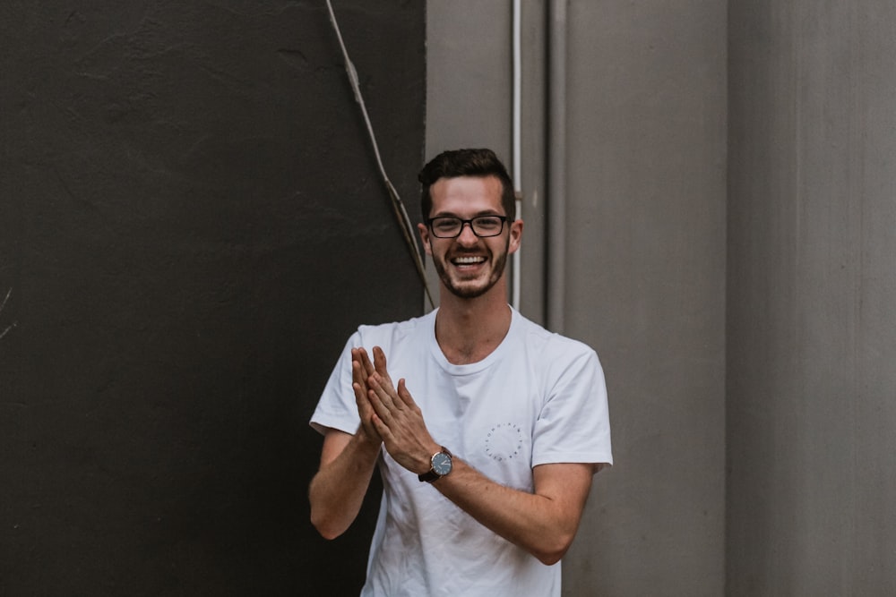 smiling man wearing white shirt