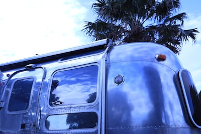 A shiny RV parked outside after a full exterior restoration.