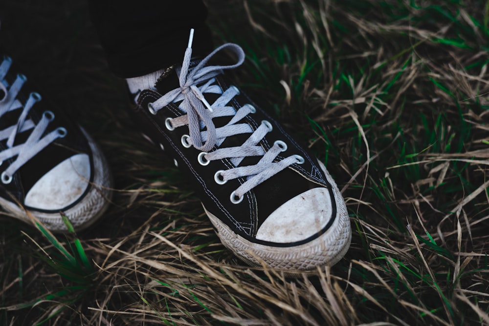 pair of black Converse lace-up shoes