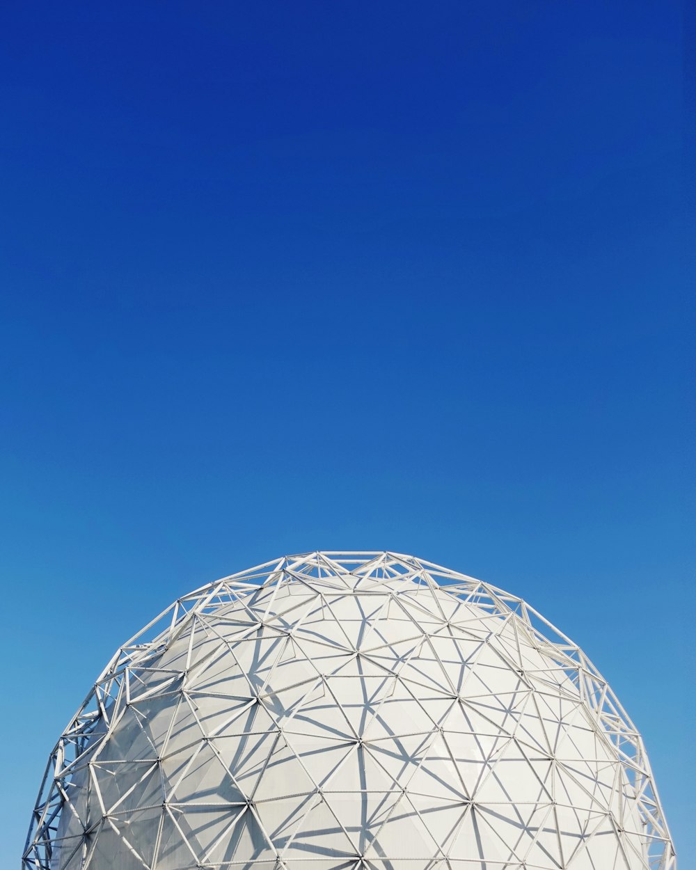 white metal dome under blue sky