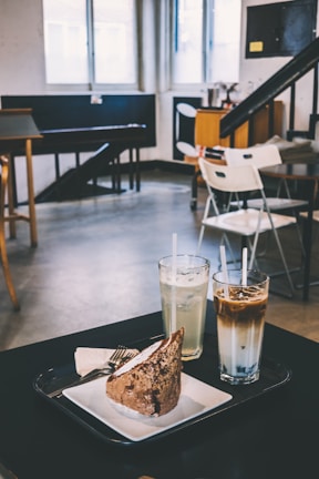 Guests enjoying coffee and cake together in a bright, inviting corner of the brasserie.