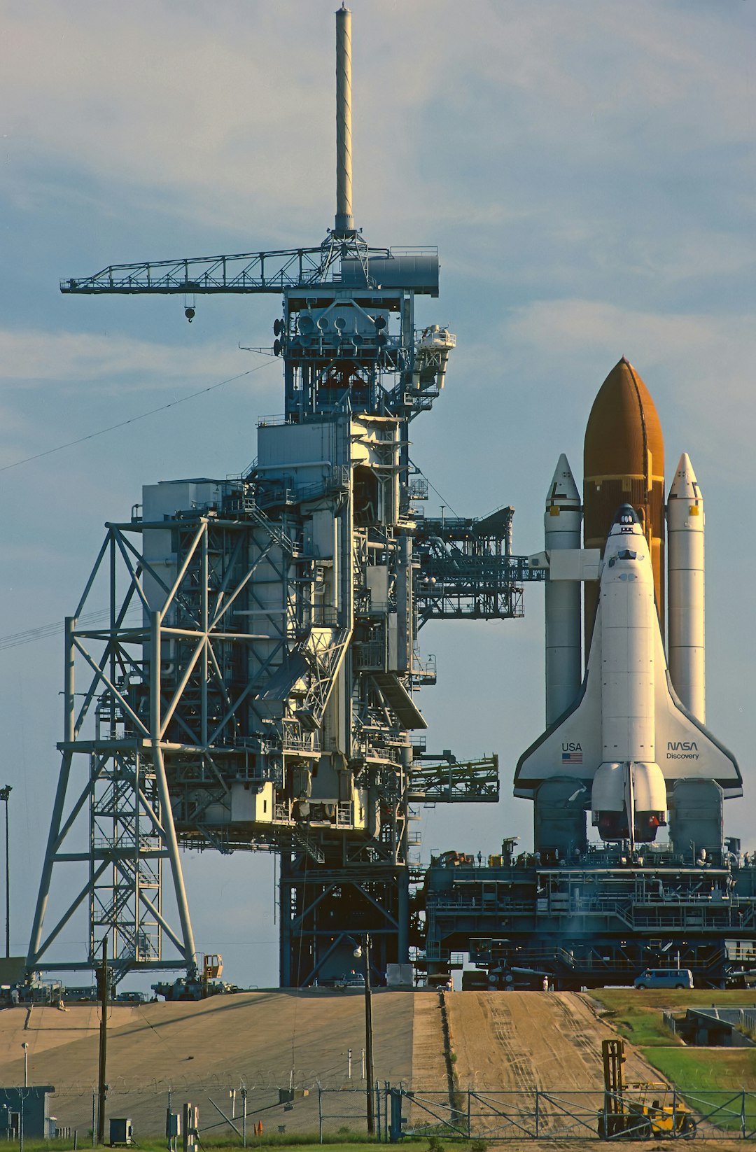 Personal one to one tour. August 1985.Taken out to launch pad very early morning.Preparing for Launch  STS-51During short window before the Service gantry is closed against the Shuttle “Discovery”.This is from a scan I did from a slide film I took,so quality not 100%.Note…Most travelled shuttle, 149 million miles, 39 missions, 365 days in orbit over 27 years.Now in the “Smithsonian Air and Space museum”