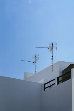 Sleek digital antenna mounted on a clean balcony with a futuristic blue and white color palette.