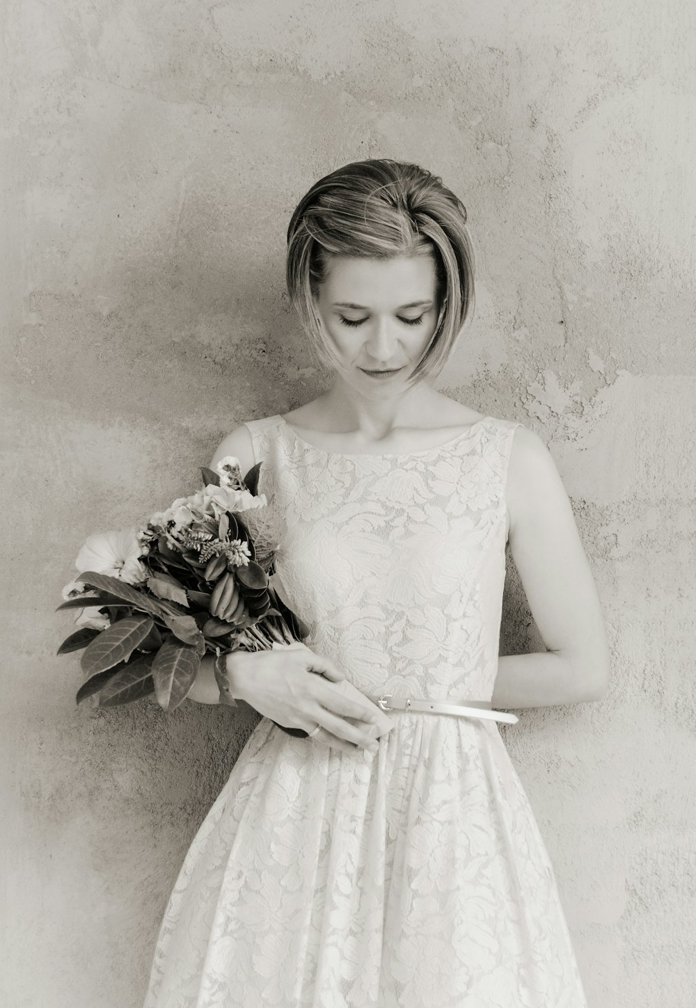 woman in floral dress holding bouquet of flower