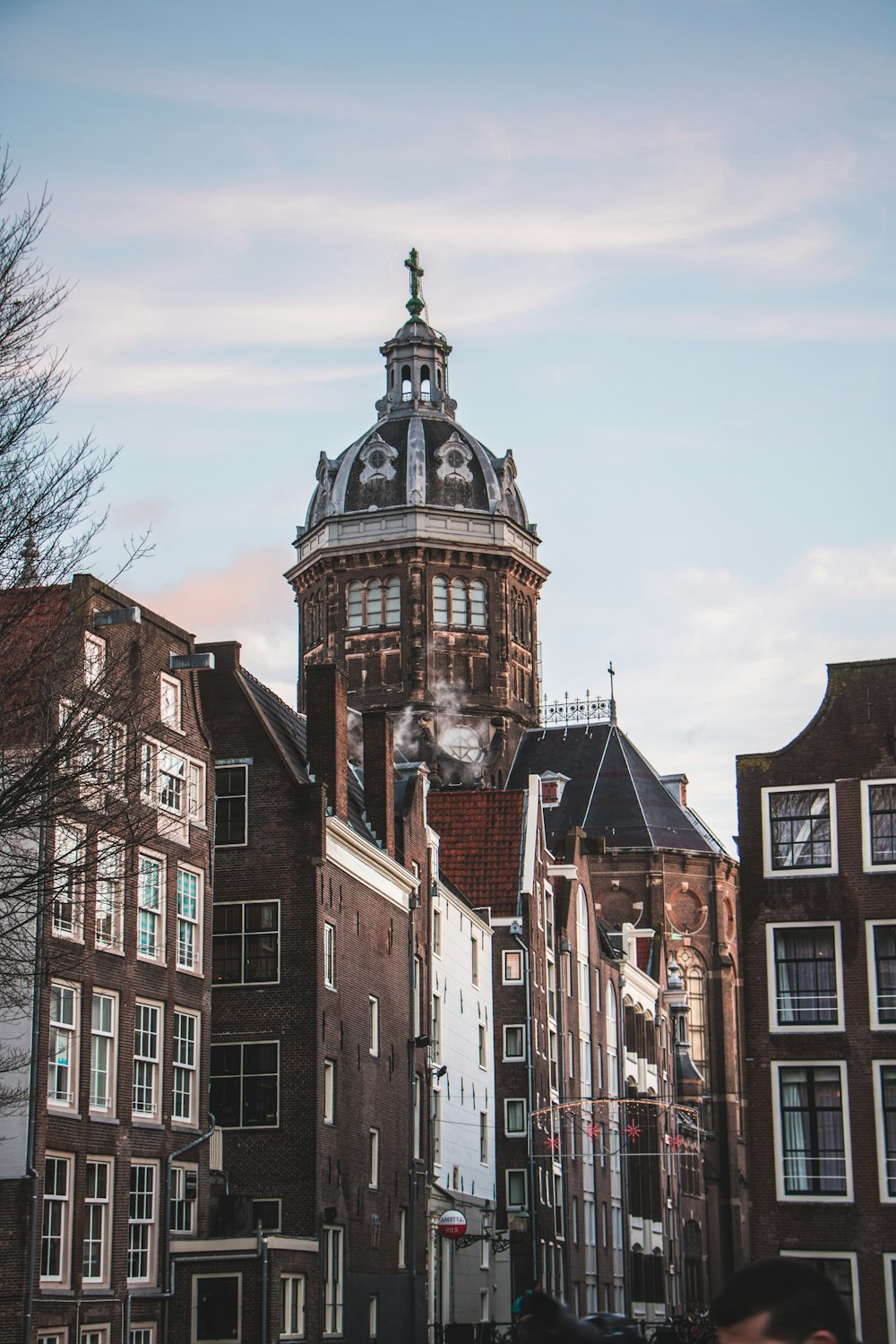 a tall building with a clock on the top of it