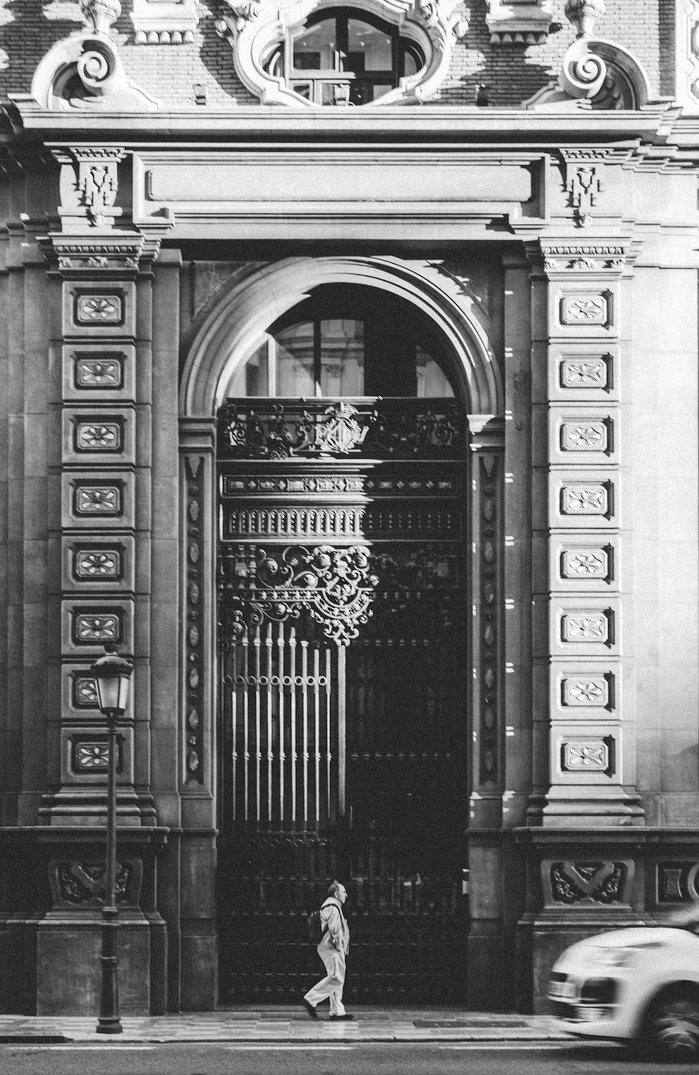 person walking in front of building