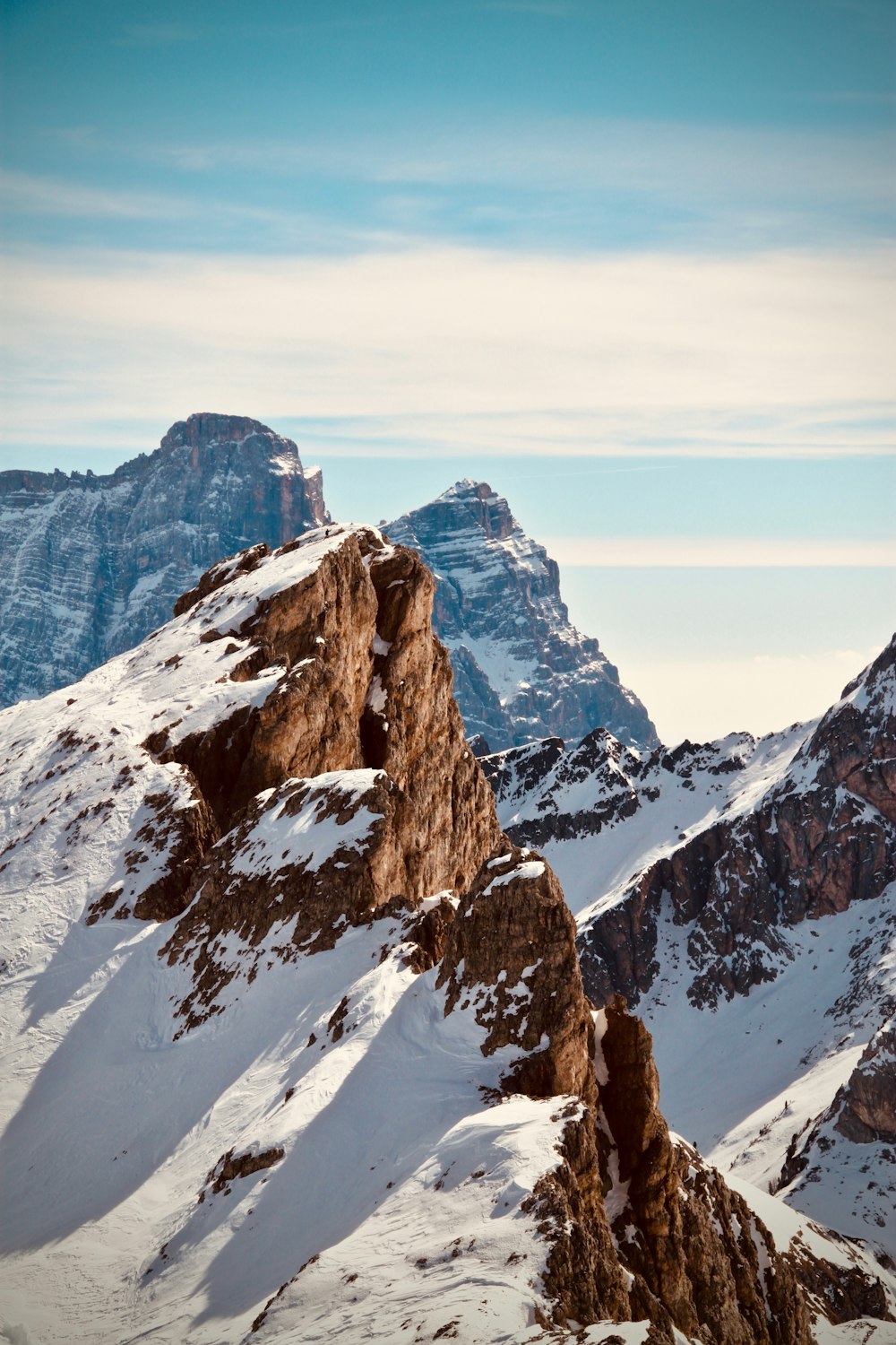 a snow covered mountain with a sky background