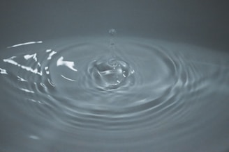 A close-up of a water droplet on a smooth surface.