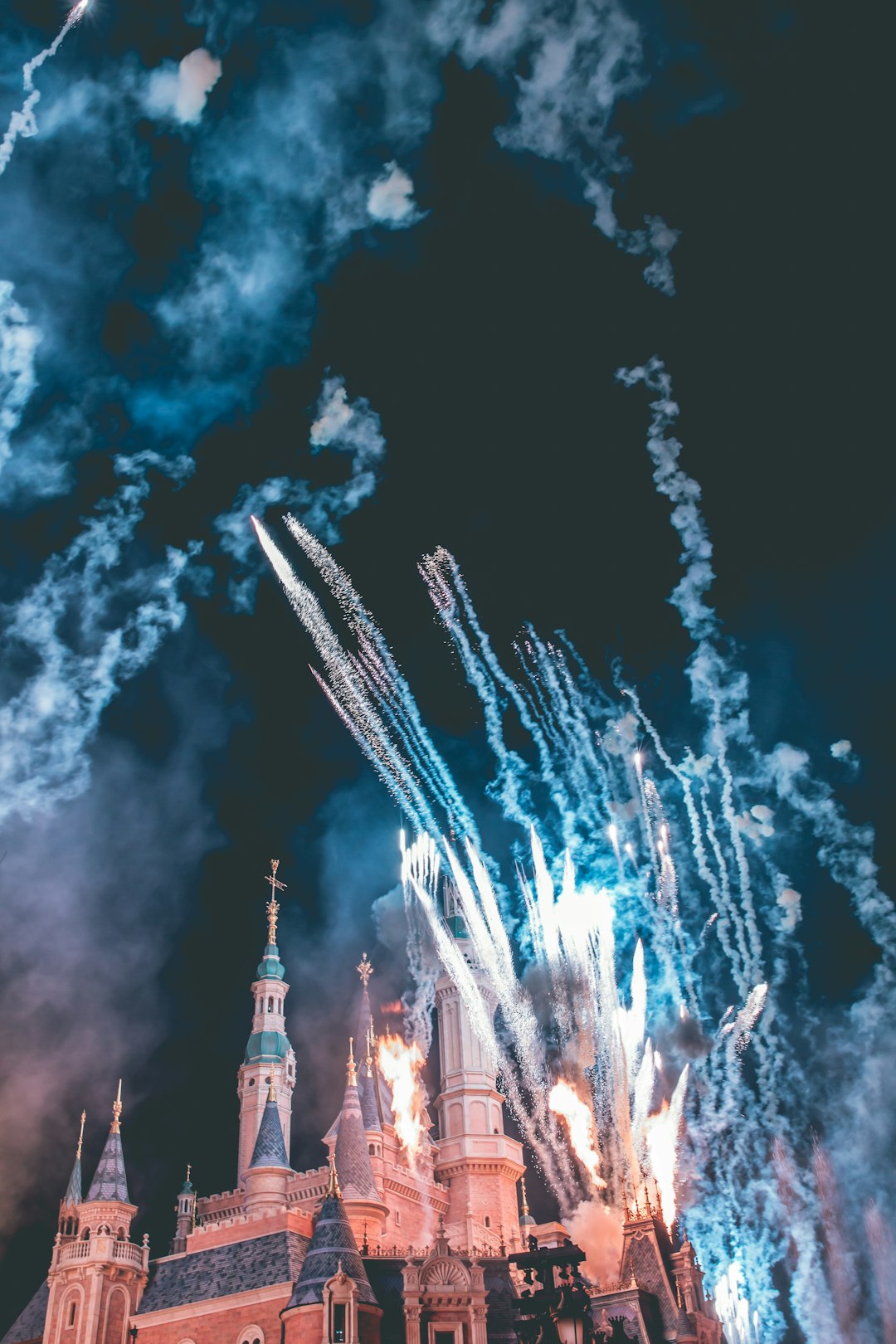 castle surrounded by fireworks