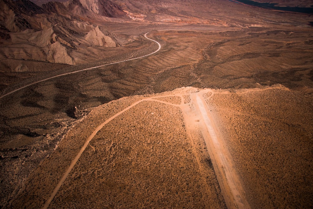 road near pathway and mountain view