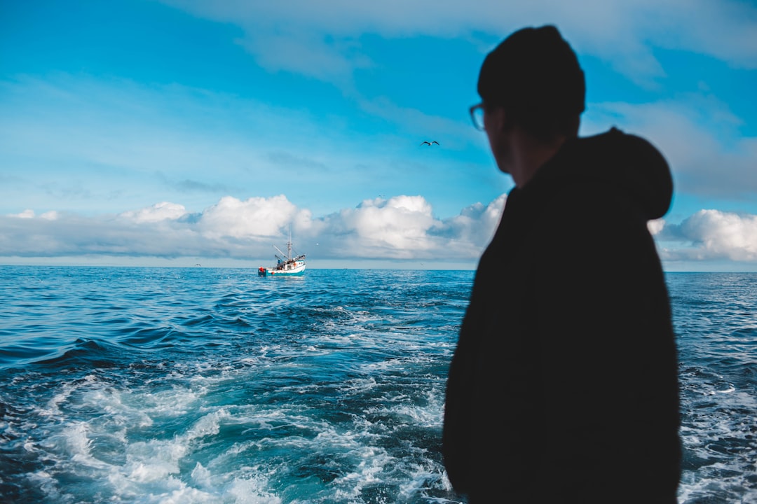 man standing in front of sea