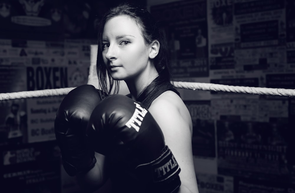 woman wearing black boxing gloves