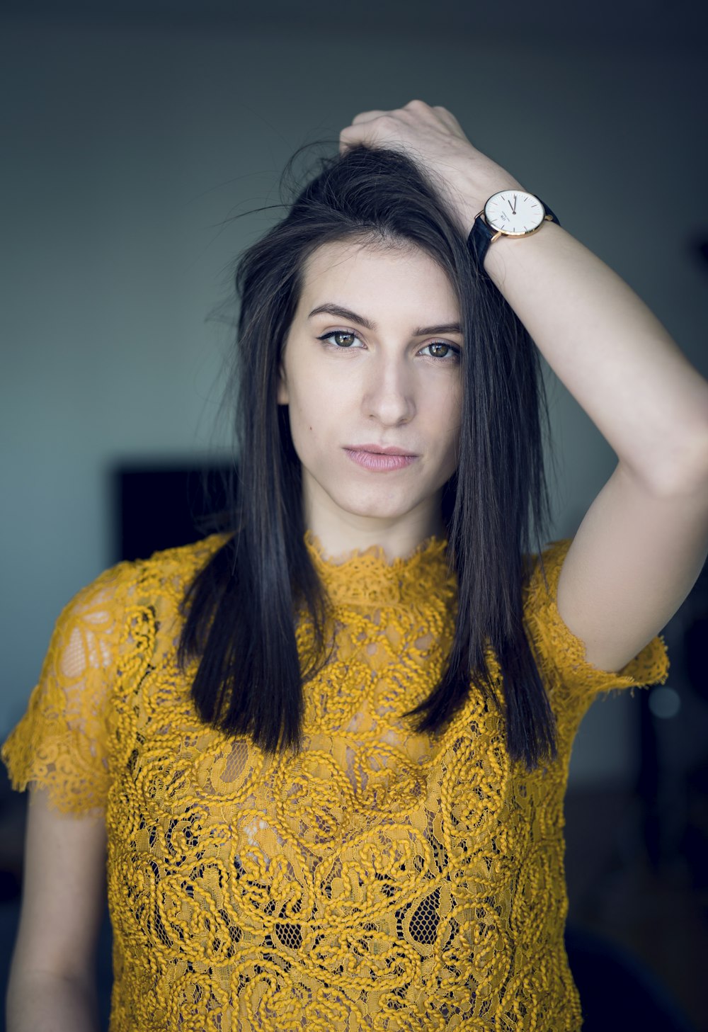 woman wearing yellow lace shirt