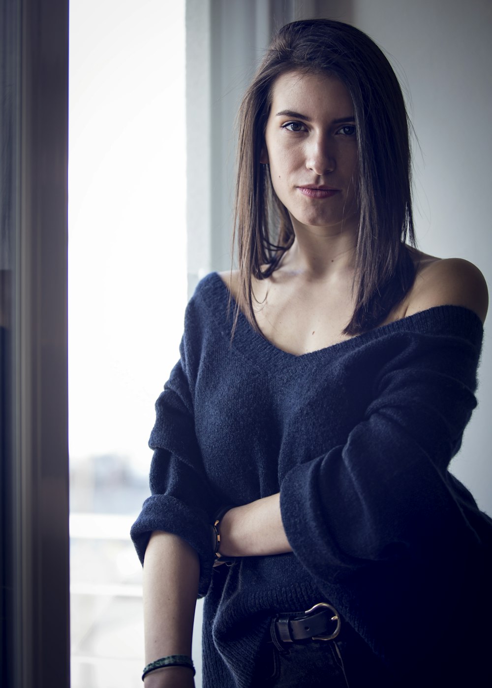 woman wearing black off-shoulder elbow-sleeved shirt