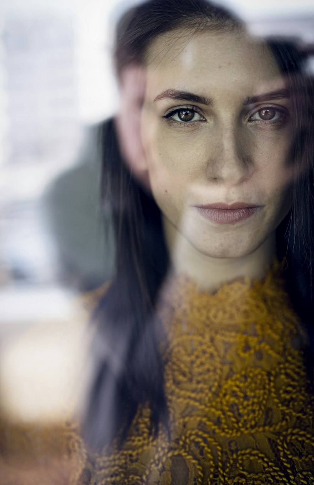 close-up photography of woman wearing orange top