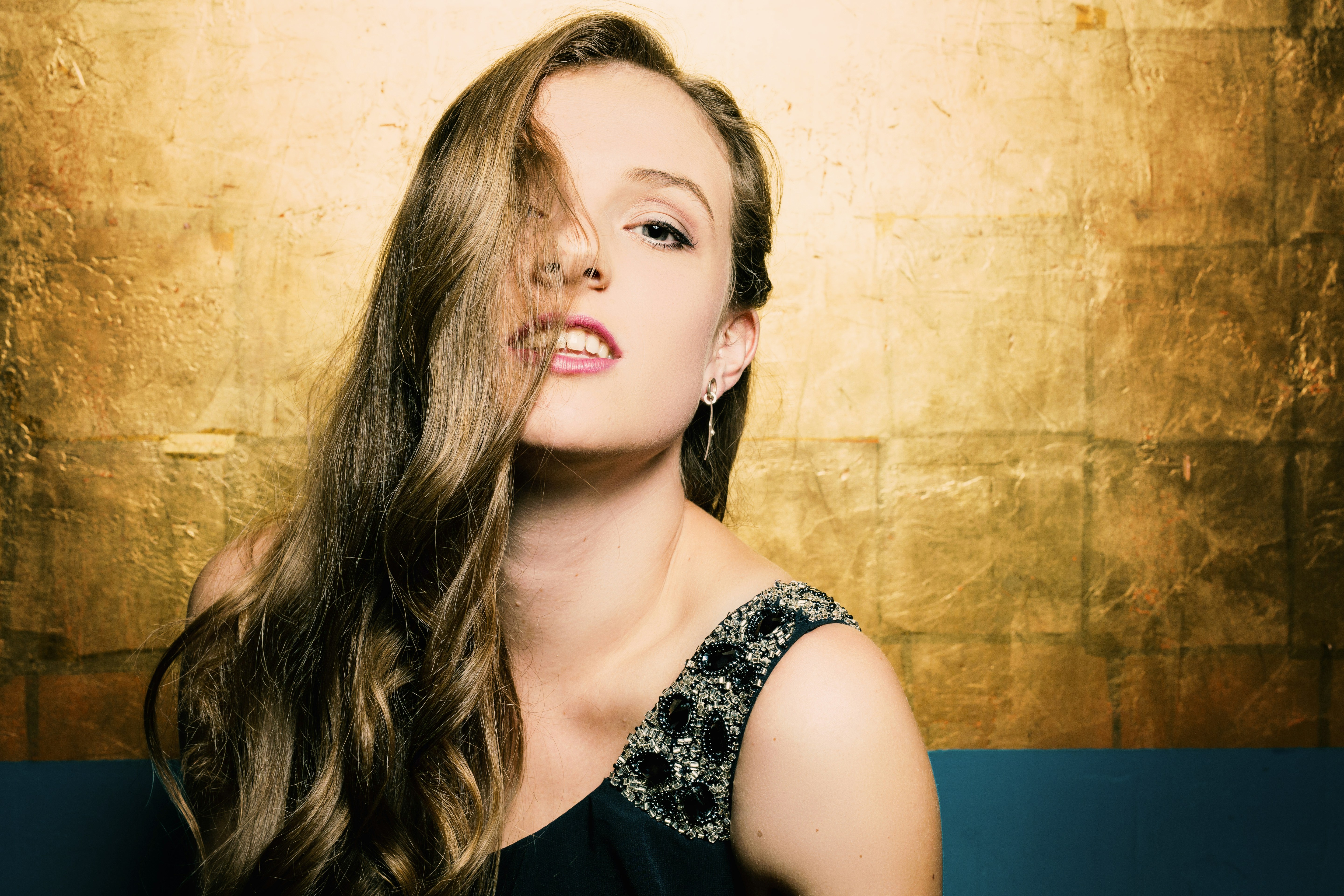 smiling woman in black tank dress