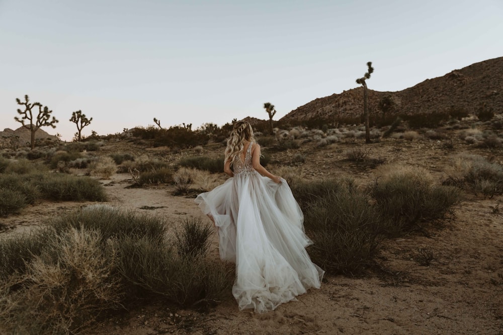 bride running at the desert