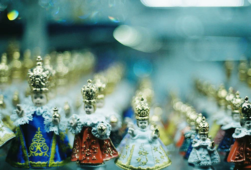 An inviting collection of mini worlds and creative sets arranged neatly with golden accents.