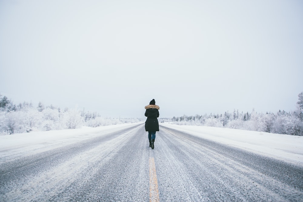 person walking on road