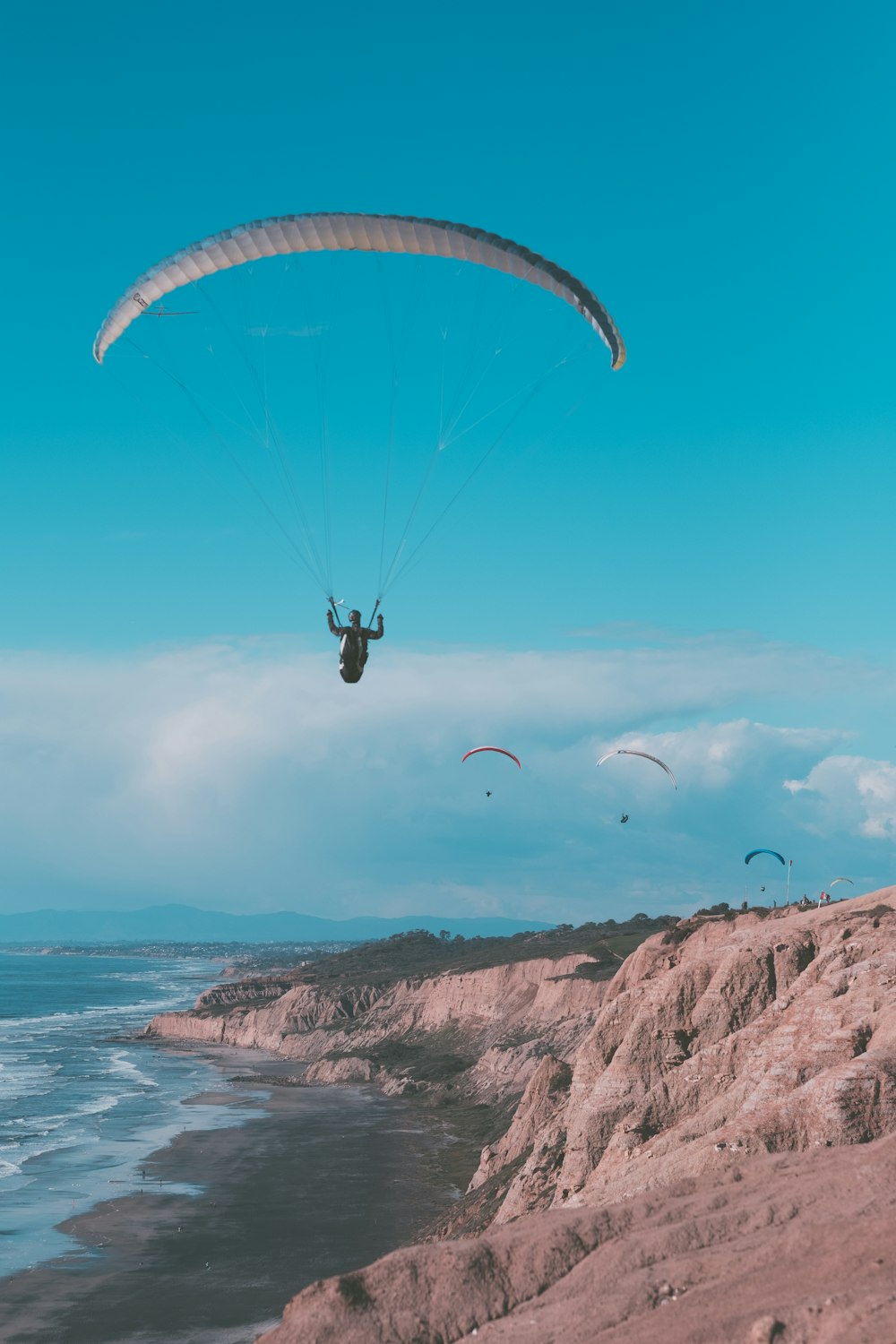 person paragliding during daytime