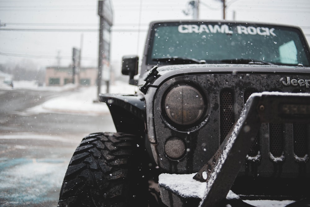 black and white Jeep SUV on road